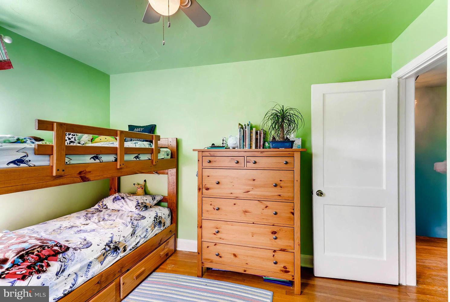 1753 Amuskai Road Baltimore, MD 21234 - Photo 20 of 28 a bed sitting in a bedroom next to a window
