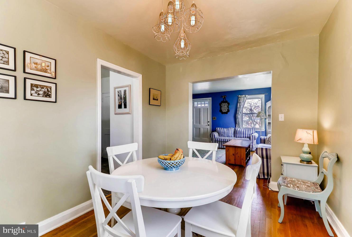 1753 Amuskai Road Baltimore, MD 21234 - Photo 7 of 28 a view of a dining room with furniture and wooden floor