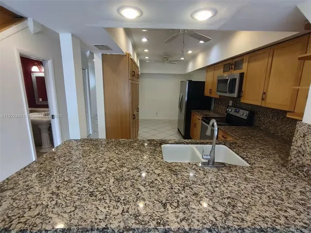 a large bathroom with a sink and a large mirror