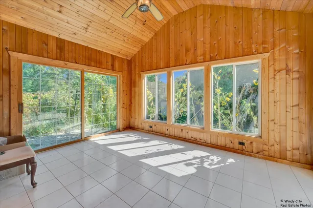 a aerial view of a house with a yard and garden