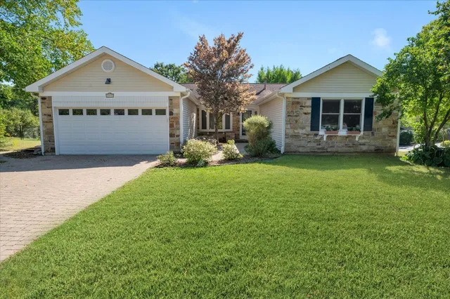 a flower plants in front of a house