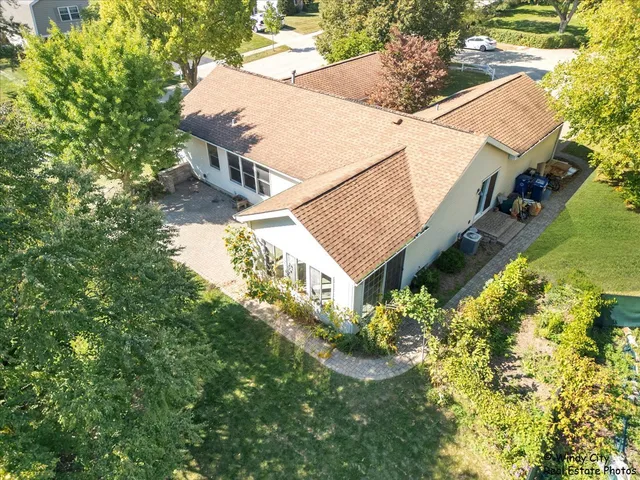 a aerial view of a house with a yard and garden