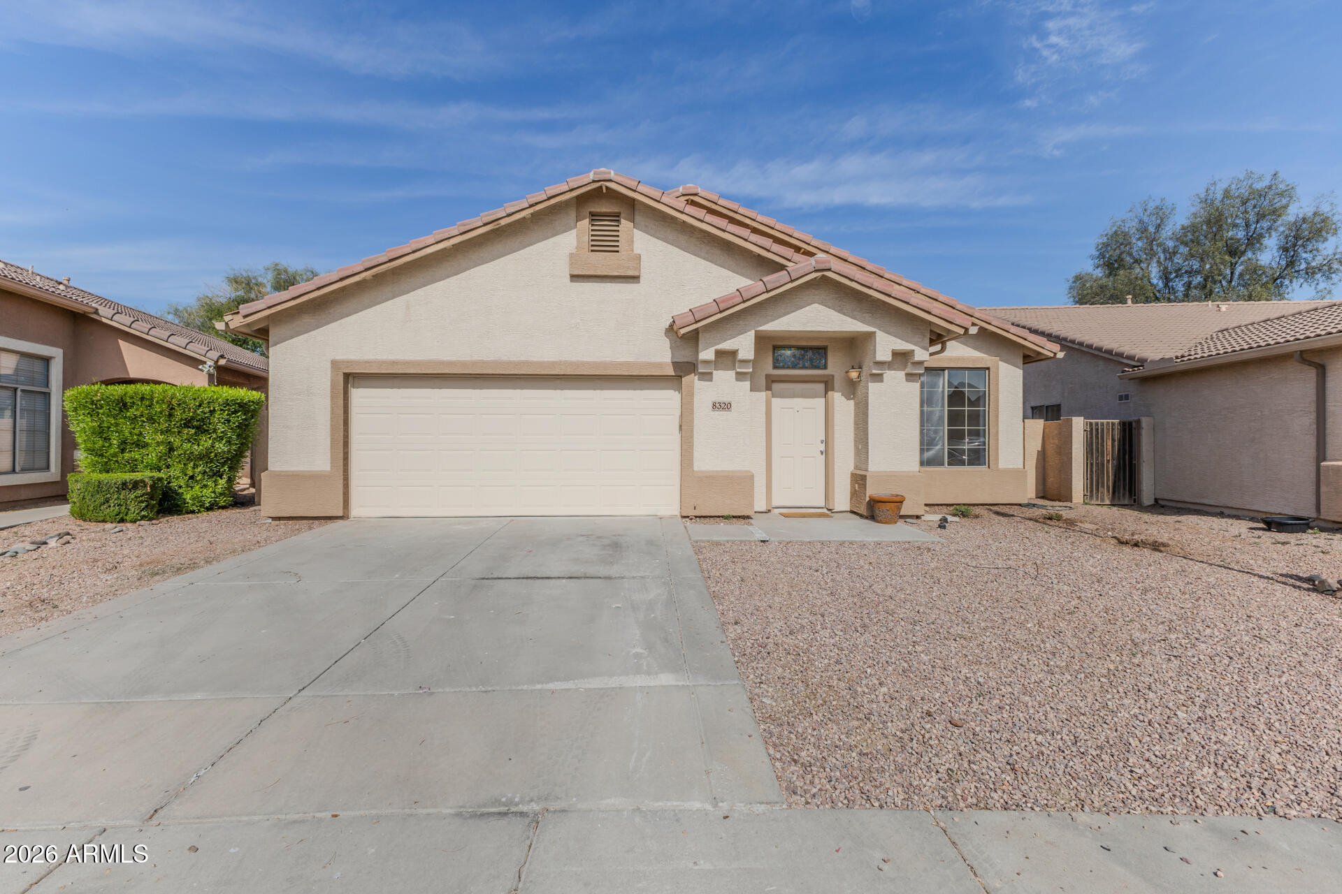a view of a house with a yard and garage