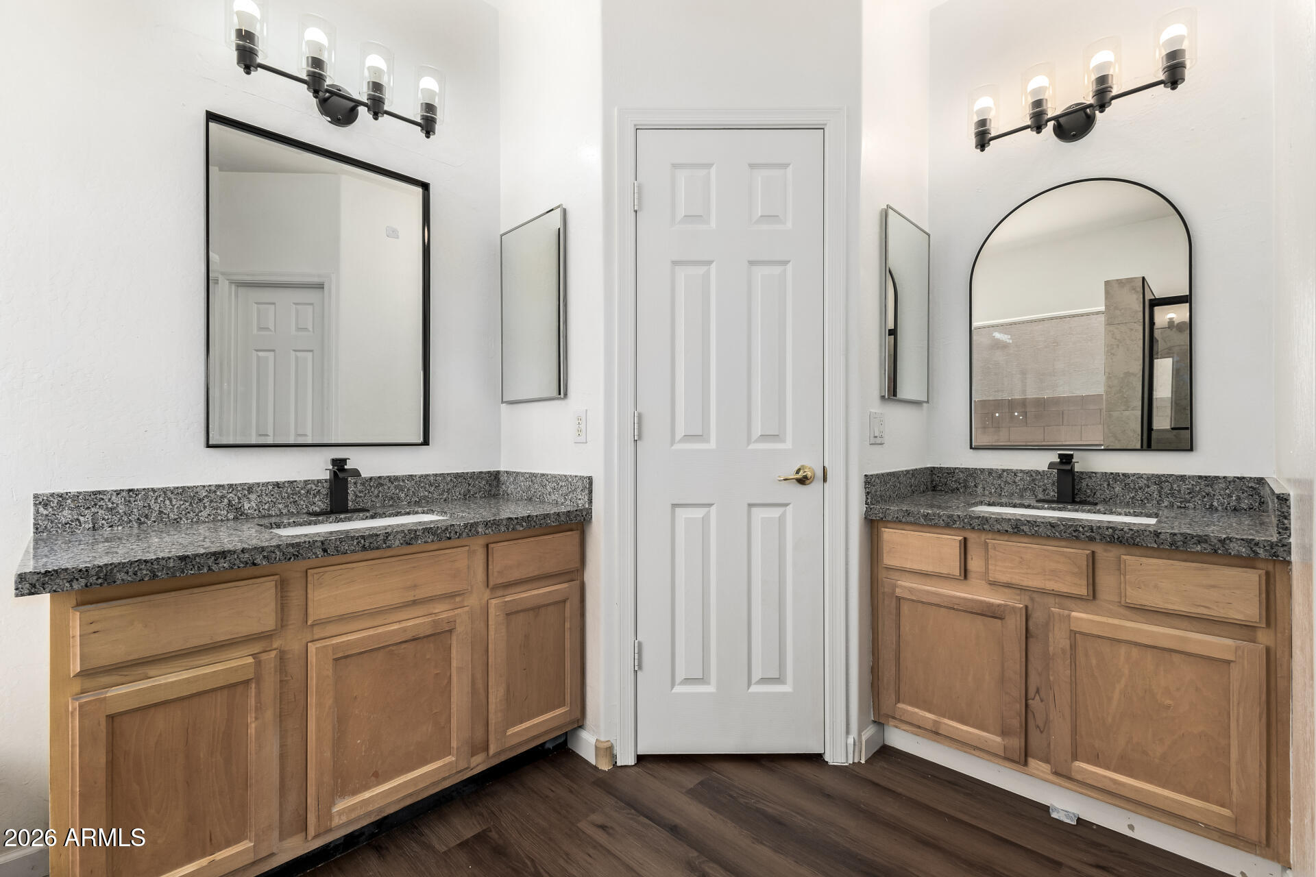 8320 West Apache Street Tolleson, AZ 85353 - Photo 16 of 31 a bathroom with a granite countertop sink a large mirror and a window