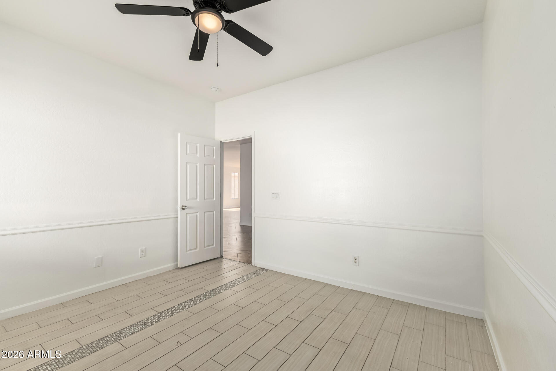8320 West Apache Street Tolleson, AZ 85353 - Photo 20 of 31 a view of a room with wooden floor
