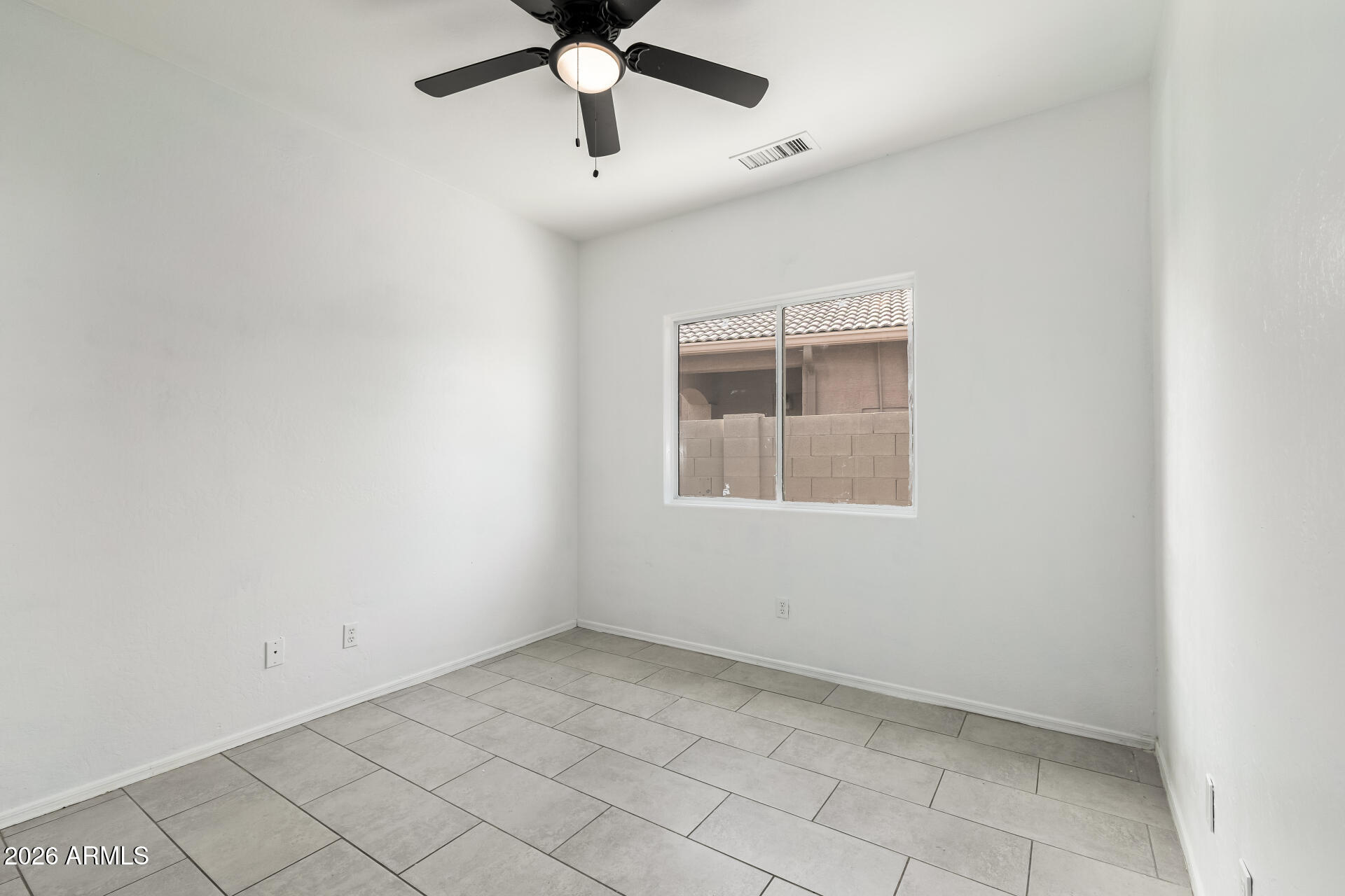 8320 West Apache Street Tolleson, AZ 85353 - Photo 21 of 31 an empty room with a window