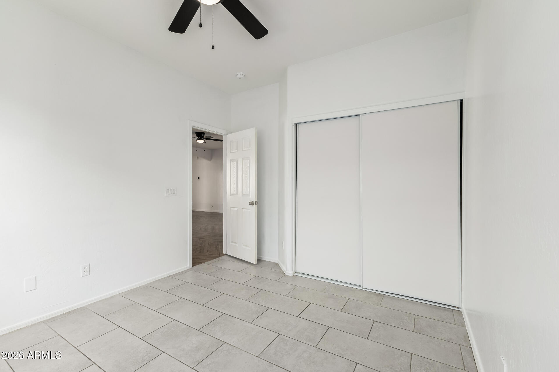 8320 West Apache Street Tolleson, AZ 85353 - Photo 22 of 31 an empty room with chandelier fan