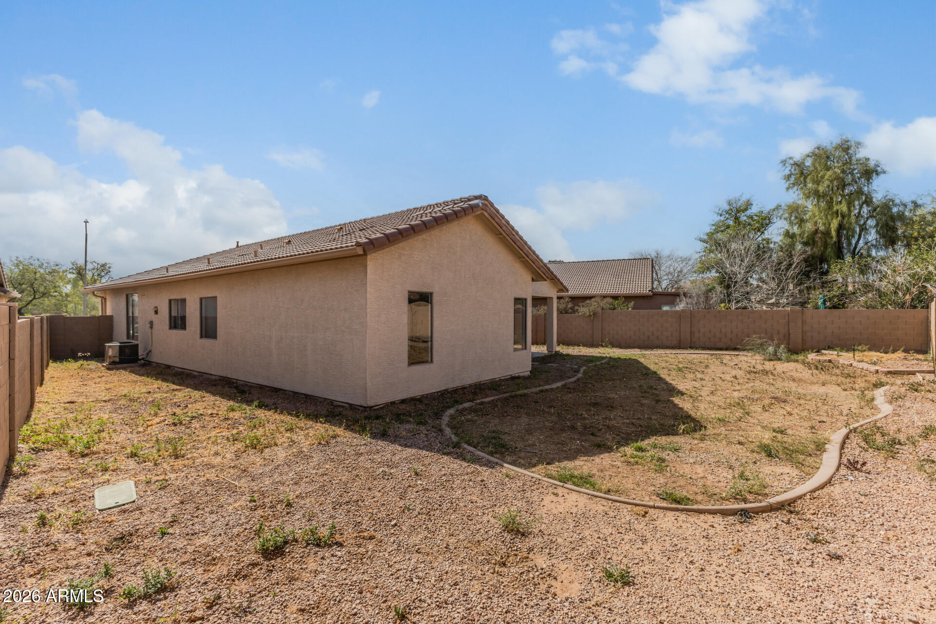 8320 West Apache Street Tolleson, AZ 85353 - Photo 28 of 31 a view of a house with a backyard