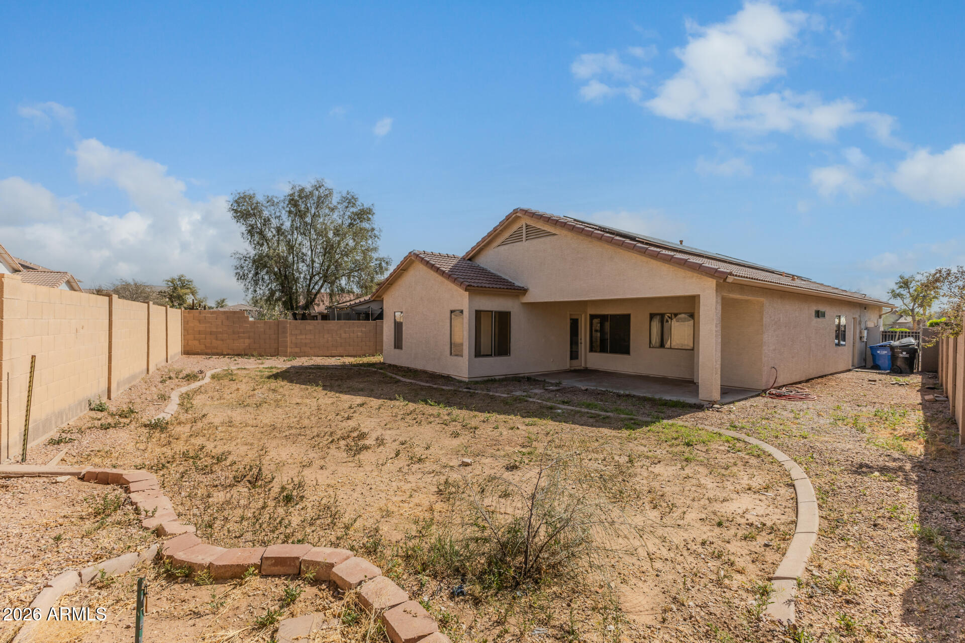 8320 West Apache Street Tolleson, AZ 85353 - Photo 30 of 31 a front view of a house with a yard