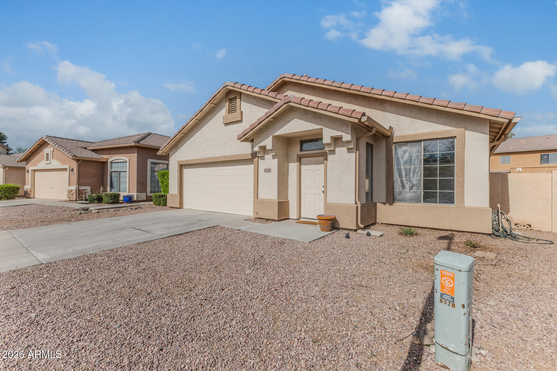 8320 West Apache Street Tolleson, AZ 85353 - Photo 3 of 31 front view of a house with a street