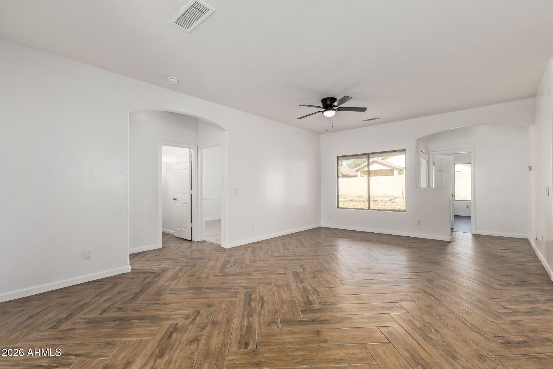 8320 West Apache Street Tolleson, AZ 85353 - Photo 8 of 31 a view of an empty room with a window
