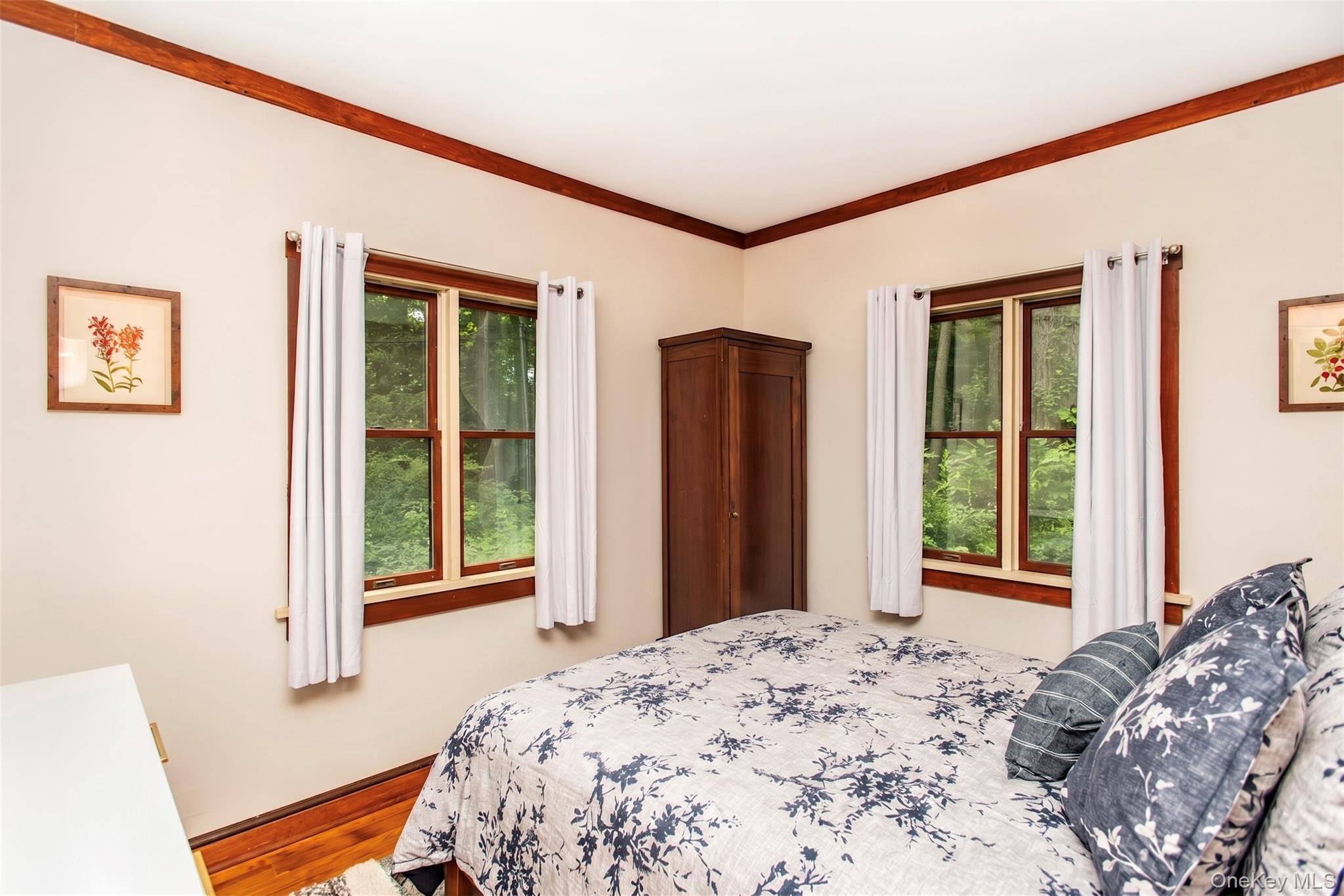 11 Locust Drive Cold Spring, NY 10516 - Photo 13 of 23 Bedroom with a brand-new queen bed, fresh linens, and a storage closet, offering a comfortable and restful retreat with convenient storage.