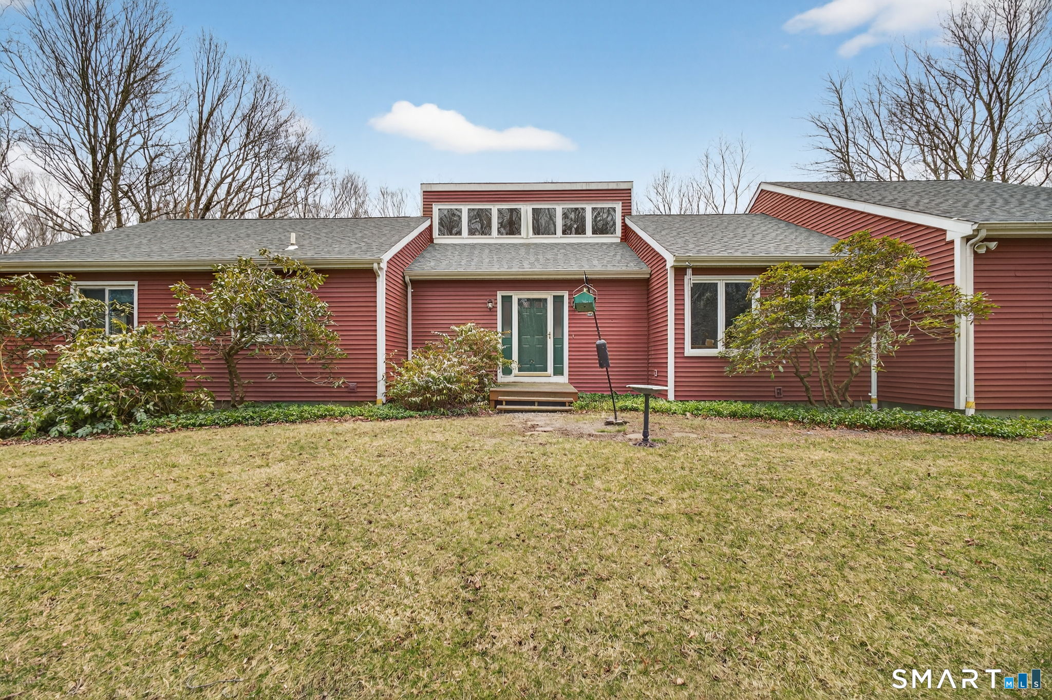 front view of a house with a yard