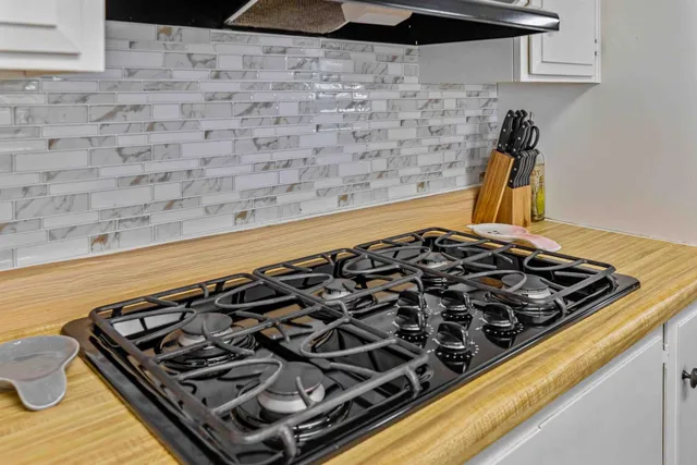 a kitchen with washing machine and sink