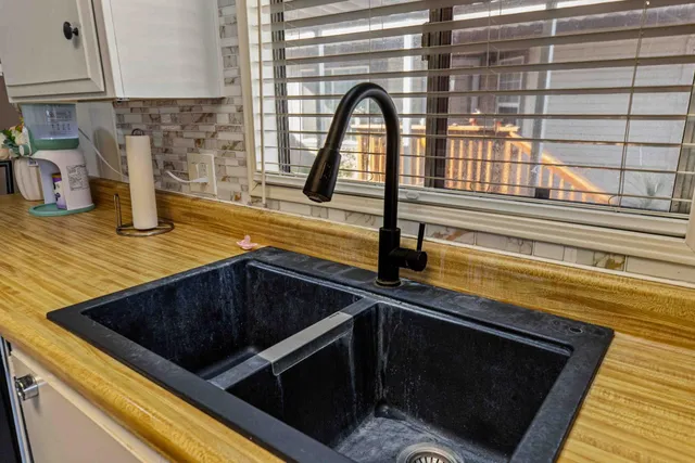 a view of a dining room with furniture large window and wooden floor