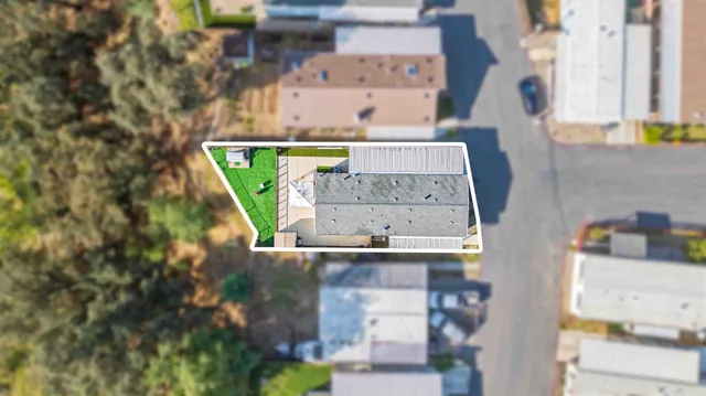 an aerial view of residential houses with outdoor space