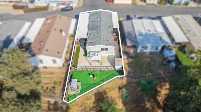 an aerial view of a house with swimming pool