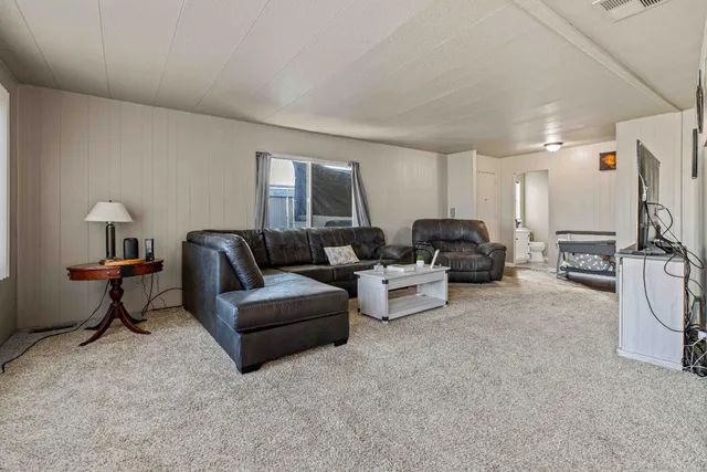 a living room with furniture and a couch