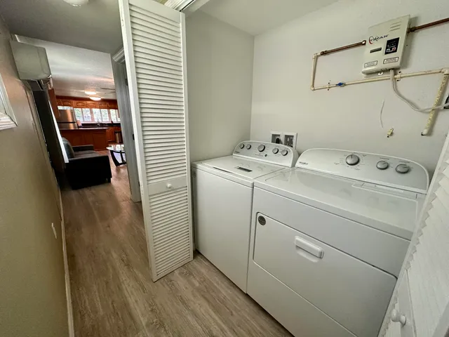 a view of storage and utility room with washer and dryer