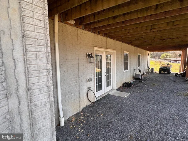 a view of a porch with seating space