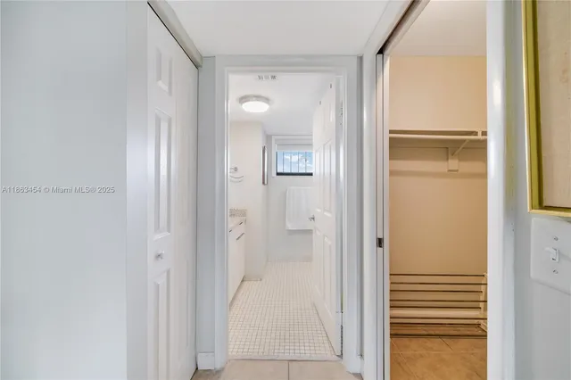 a view of a bathroom from a hallway