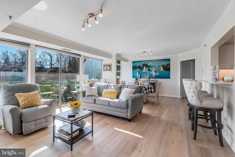 a kitchen with cabinets stainless steel appliances and a sink