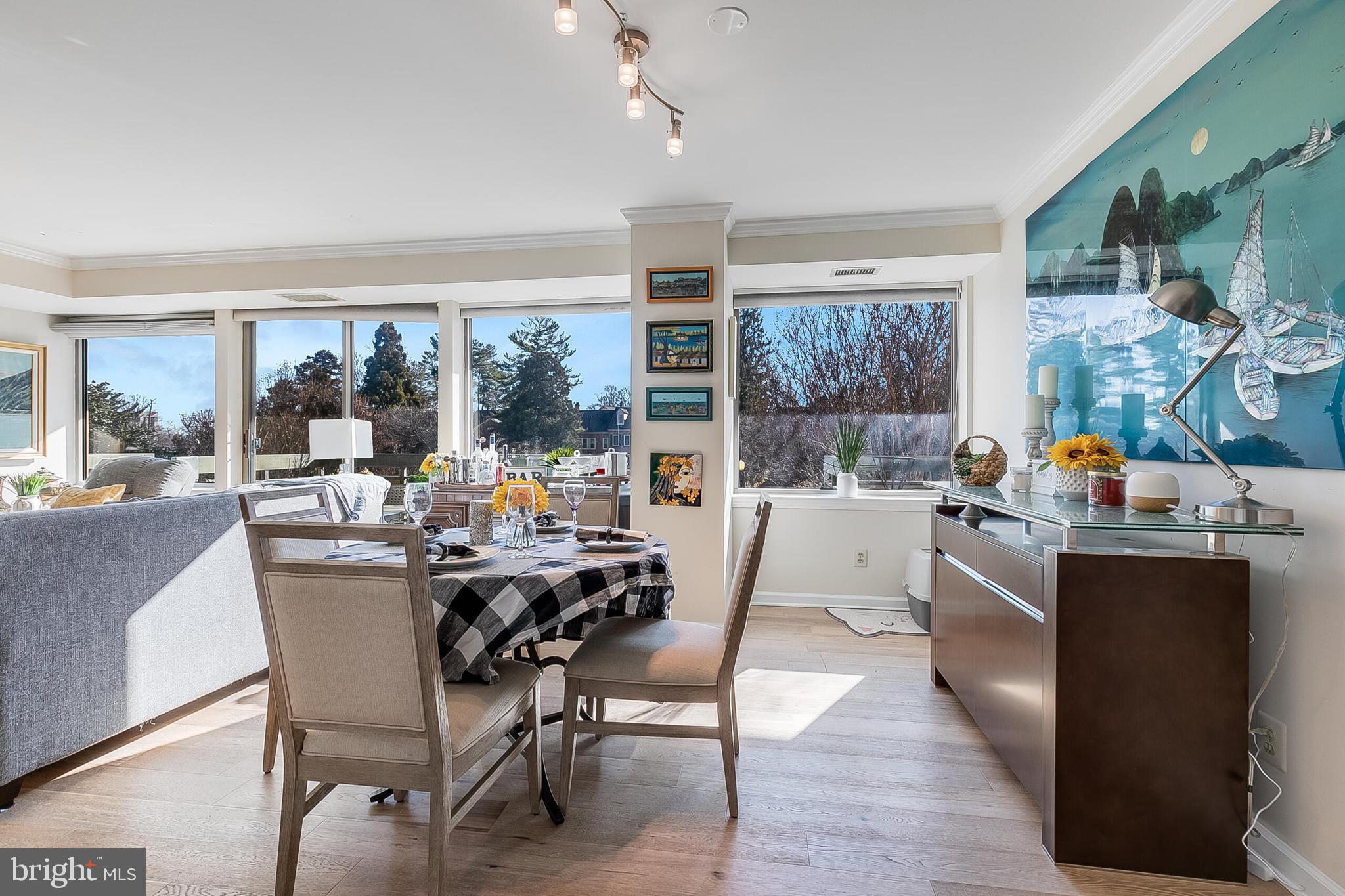 5450 Whitley Park Terrace, Unit 209 Bethesda, MD 20814 - Photo 16 of 29 a dining room with wooden floor and a window