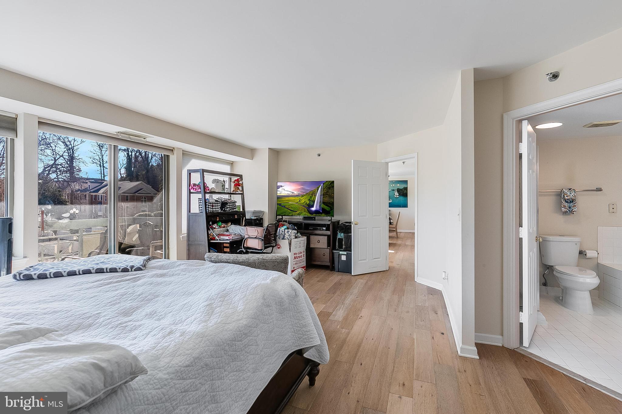 5450 Whitley Park Terrace, Unit 209 Bethesda, MD 20814 - Photo 18 of 29 a living room with furniture and a wooden floor