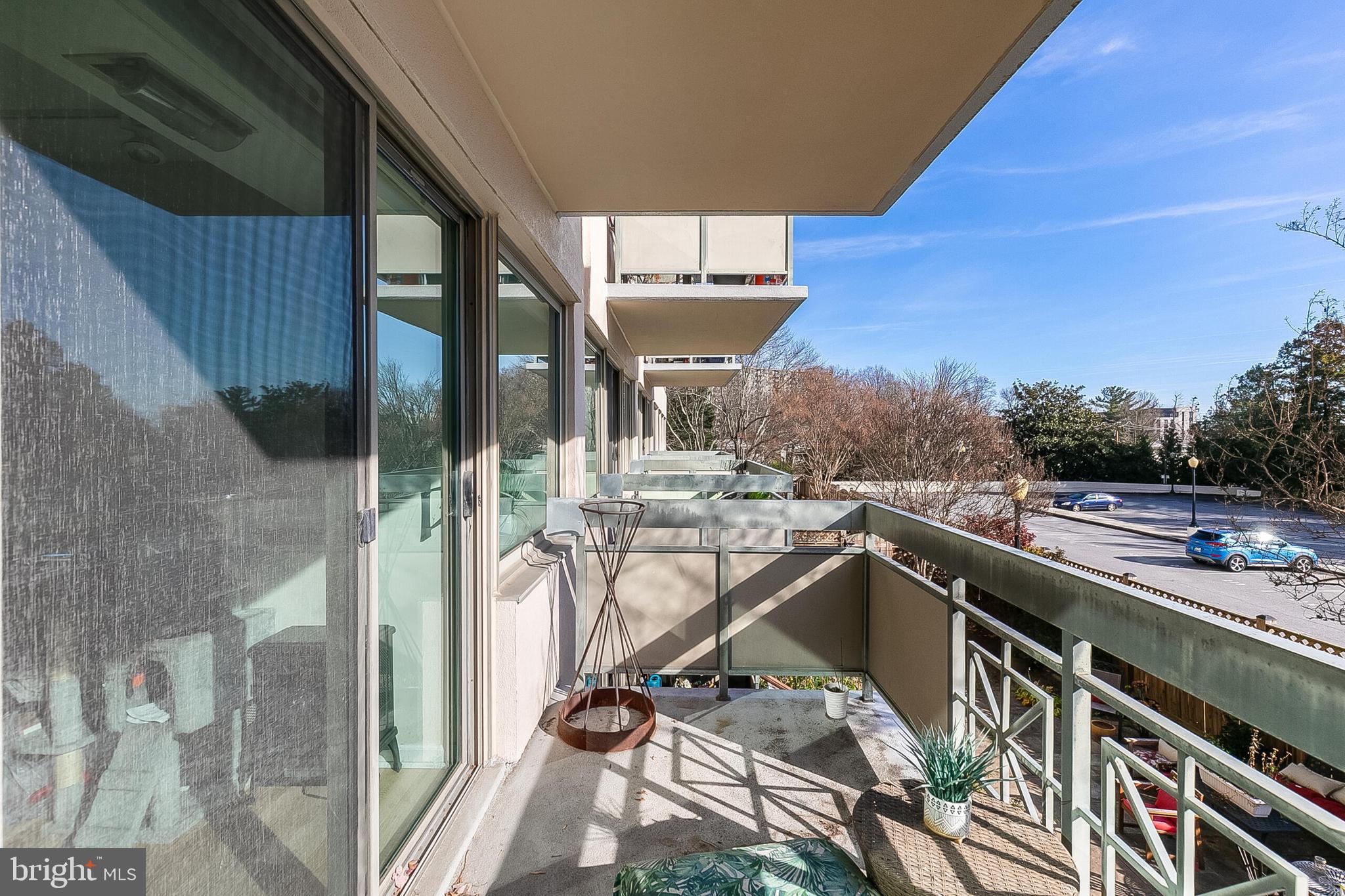 5450 Whitley Park Terrace, Unit 209 Bethesda, MD 20814 - Photo 28 of 29 a view of a balcony with furniture and a rug