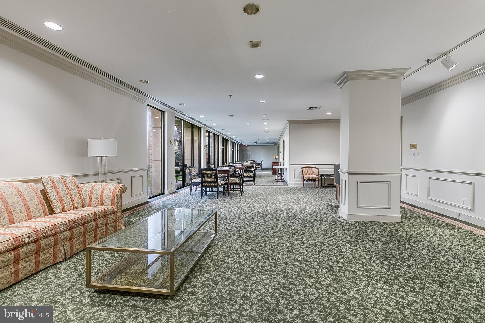 5450 Whitley Park Terrace, Unit 209 Bethesda, MD 20814 - Photo 7 of 29 a living room with furniture