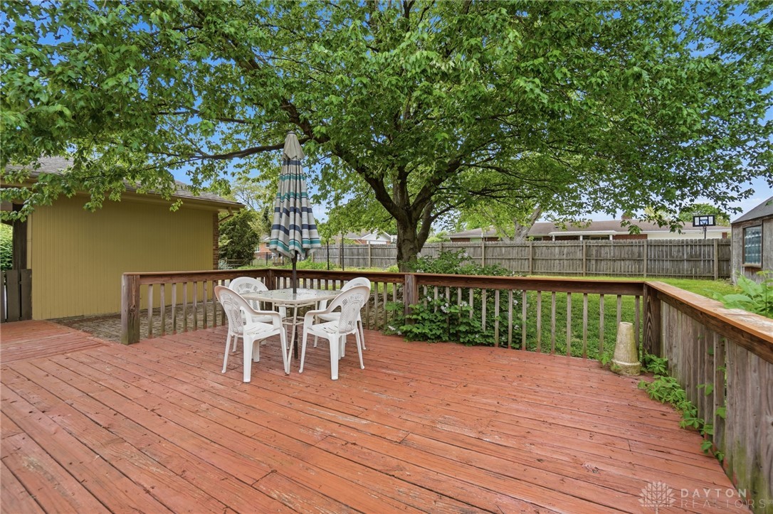 6119 Flemington Road Dayton, OH 45459 - Photo 64 of 76 This spacious wooden deck offers an ideal spot for outdoor enjoyment and entertaining.