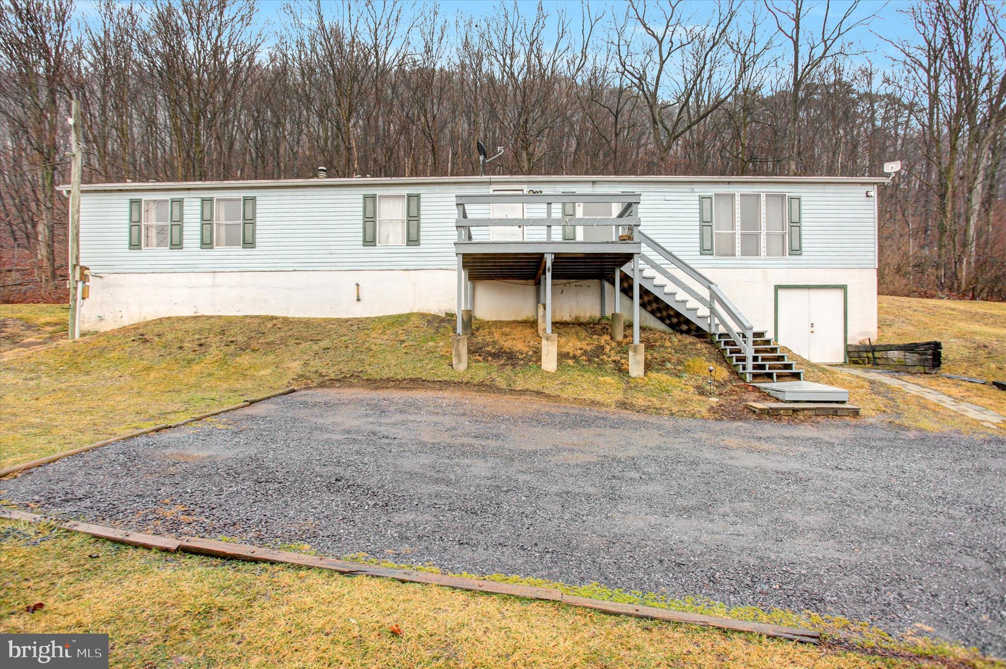 18103 Spring Run Road Dry Run, PA 17220 - Photo 1 of 33 a view of a house with a yard and sitting area