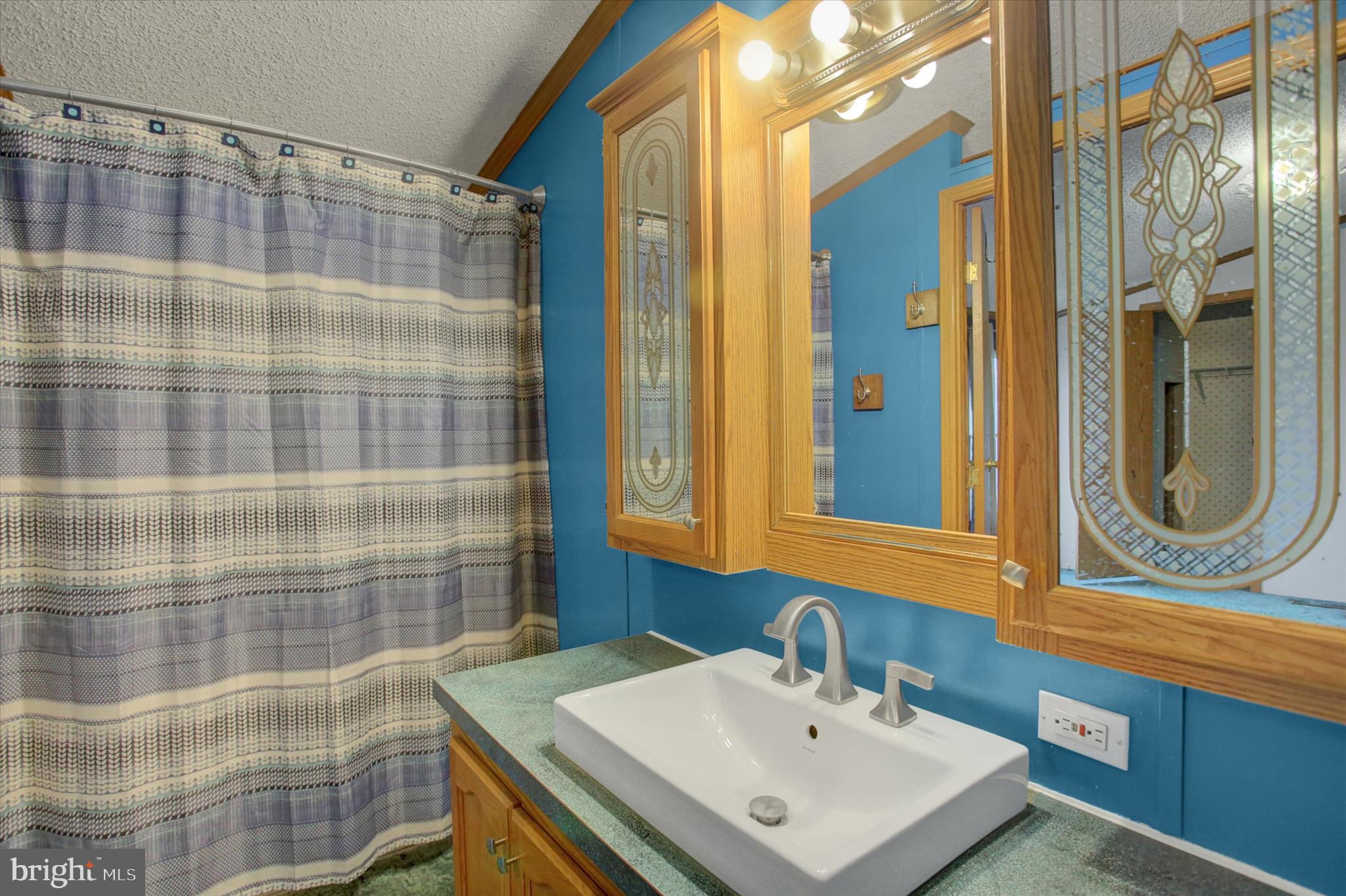 18103 Spring Run Road Dry Run, PA 17220 - Photo 23 of 33 a bathroom with a sink and a mirror