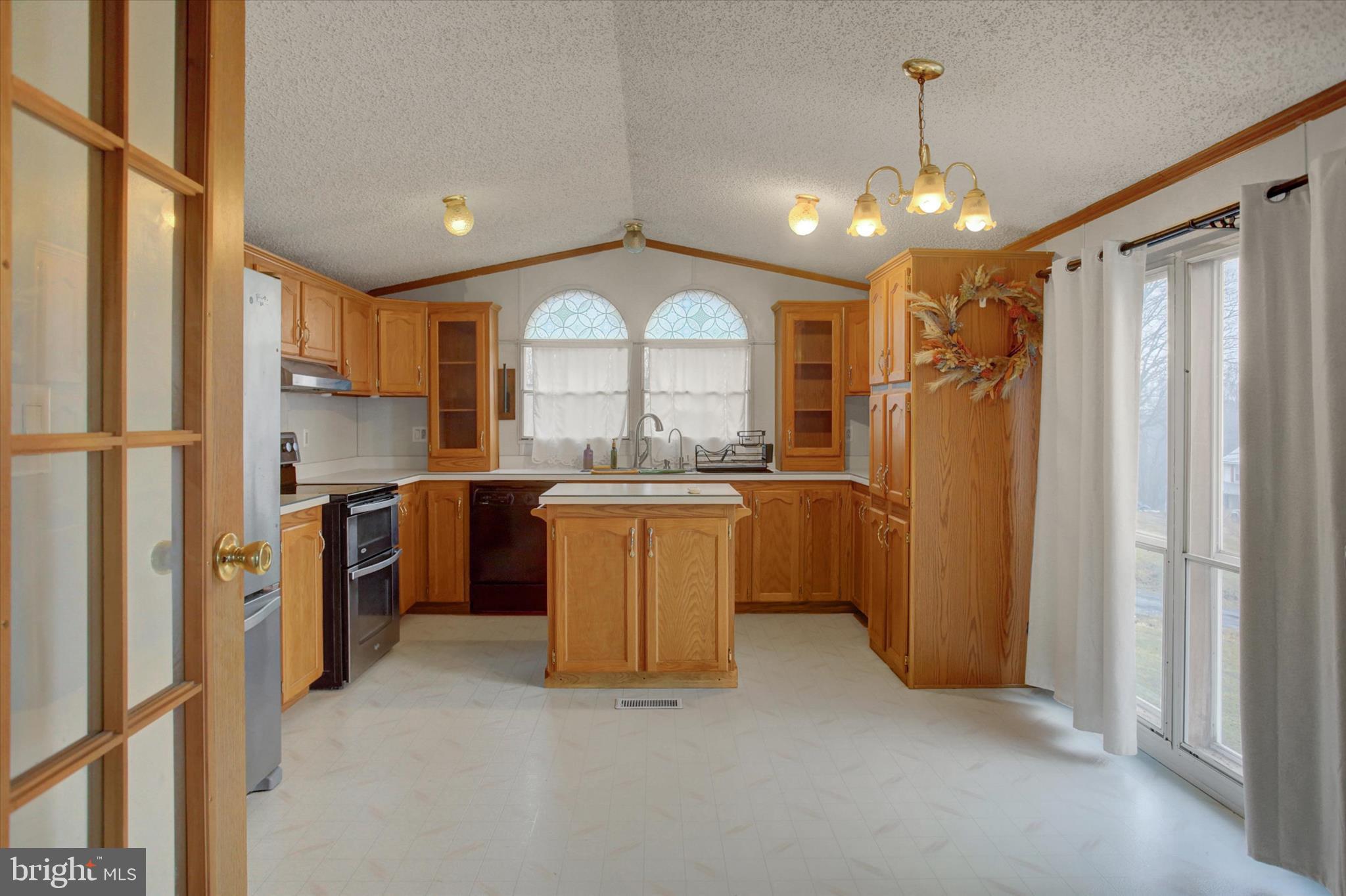 18103 Spring Run Road Dry Run, PA 17220 - Photo 8 of 33 a view of a kitchen with a sink and dishwasher a refrigerator with wooden floor