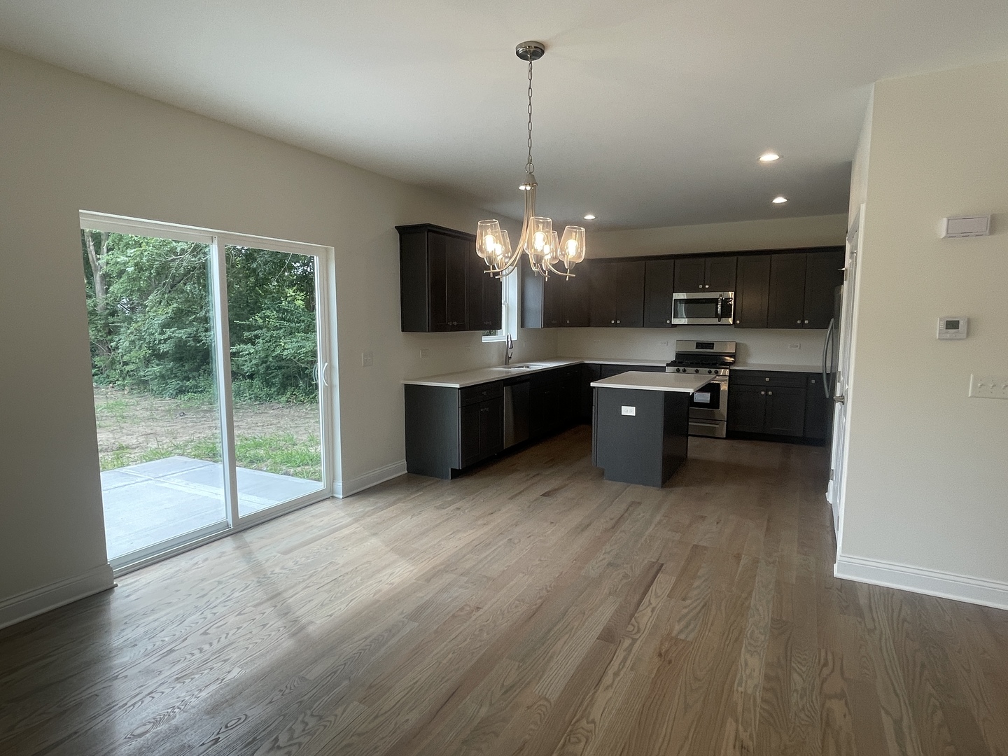 18800 Sara Road Mokena, IL 60448 - Photo 5 of 24 a large kitchen with kitchen island a large island in the center and stainless steel appliances