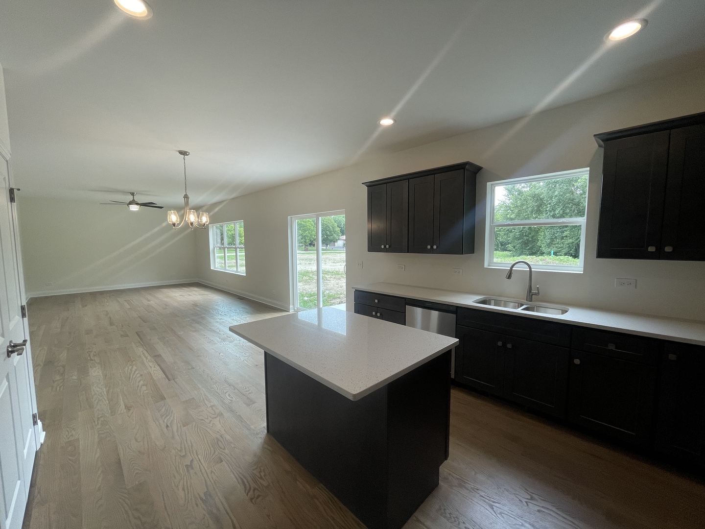 18800 Sara Road Mokena, IL 60448 - Photo 6 of 24 a kitchen with granite countertop a sink and a stove top oven