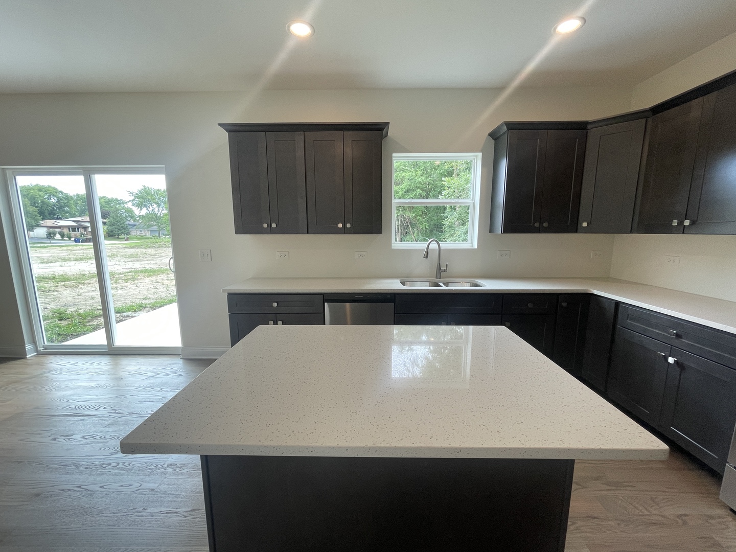 18800 Sara Road Mokena, IL 60448 - Photo 10 of 24 a kitchen with a sink a large window and a kitchen island