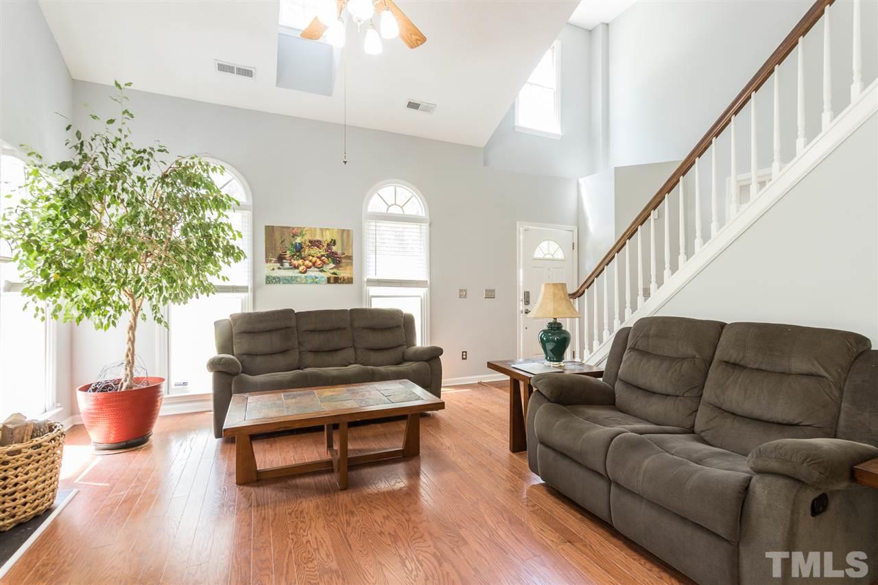 3549 Dechart Lane Raleigh, NC 27616 - Photo 8 of 26 a living room with furniture and a potted plant