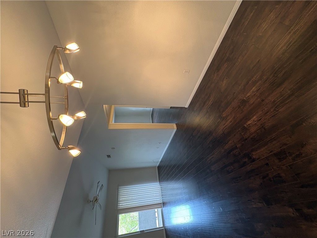 7255 West Sunset Road, Unit 2023 Las Vegas, NV 89113 - Photo 10 of 24 Rich dark wood flooring contrasts beautifully with crisp light walls in this versatile open living space.