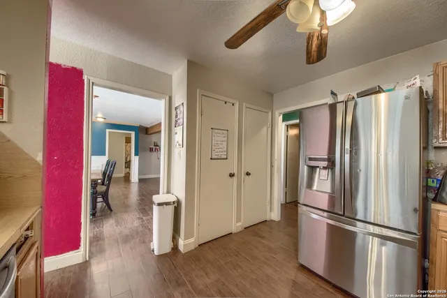 a kitchen with stainless steel appliances granite countertop a refrigerator and microwave