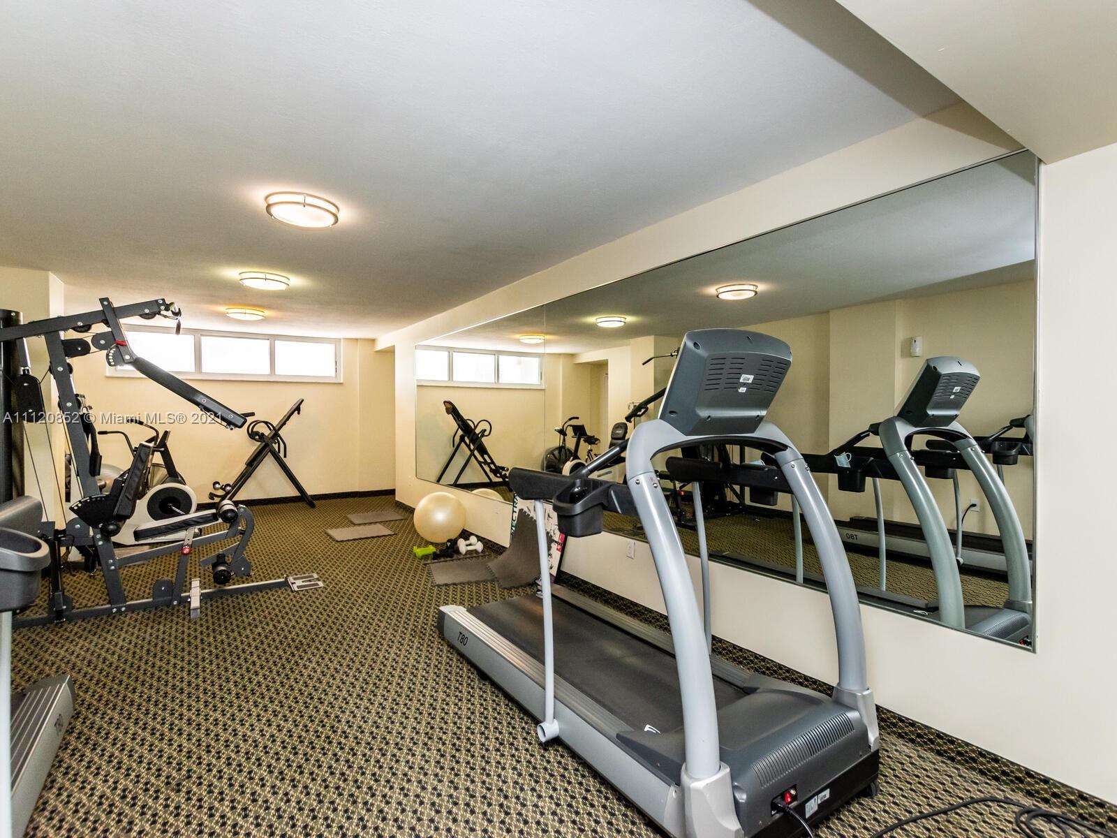 9273 Collins Avenue, Unit 801 Surfside, FL 33154 - Photo 25 of 47 a view of a room with gym equipment