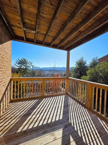 a view of balcony with wooden floor