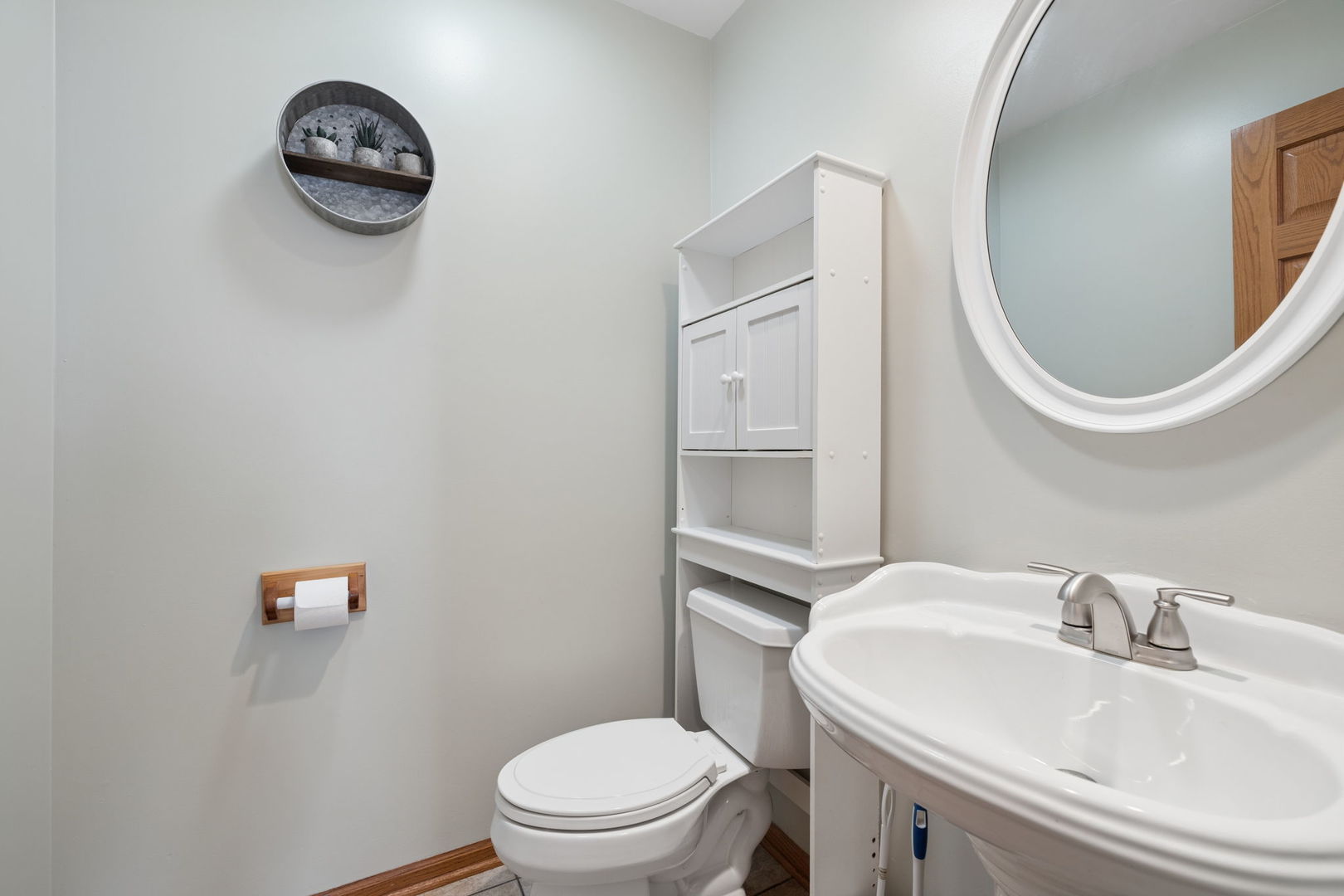 611 Prairie View Lane Hinckley, IL 60520 - Photo 16 of 40 a white toilet sitting next to a bathroom sink