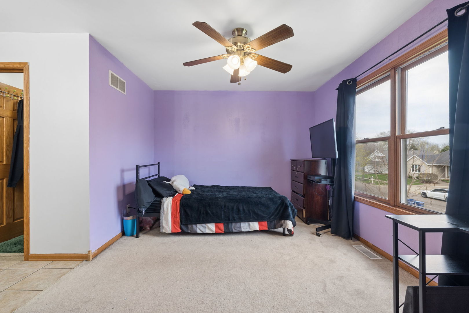 611 Prairie View Lane Hinckley, IL 60520 - Photo 23 of 40 a living room with furniture and a floor to ceiling window