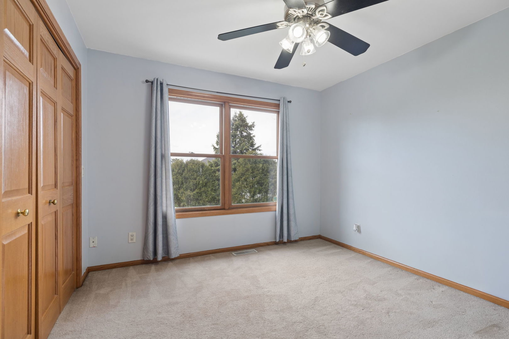 611 Prairie View Lane Hinckley, IL 60520 - Photo 30 of 40 an empty room with chandelier fan and windows