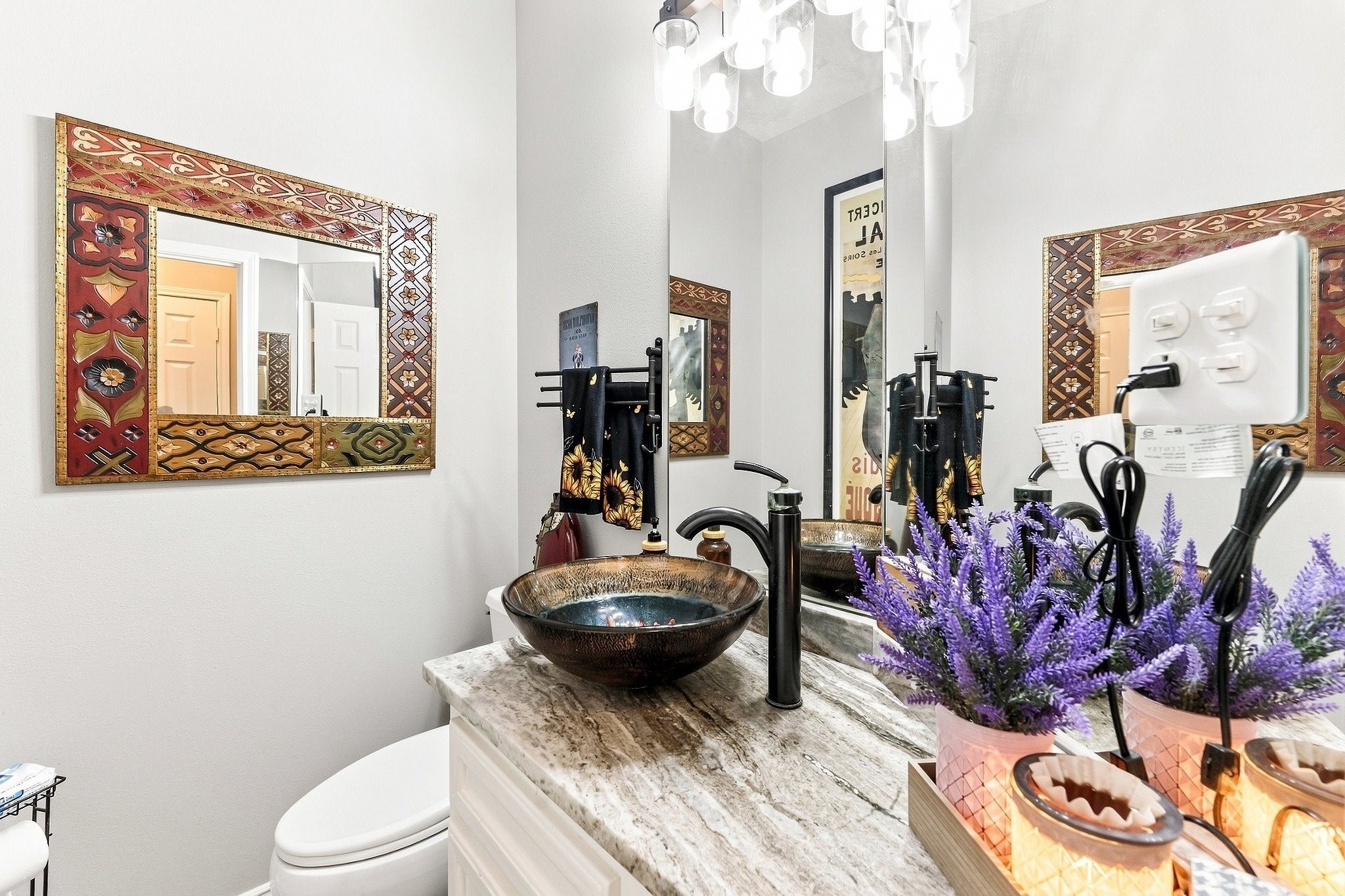 9010 Point Barrow Road Beach City, TX 77523 - Photo 12 of 50 Downstairs half bath brings its own personality with a statement vessel sink, dramatic fixtures & a polished finish for guests.