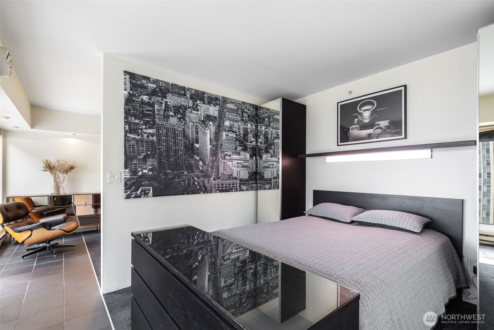 1415 2nd Avenue, Unit 2108 Seattle, WA 98101 - Photo 12 of 27 a bedroom with a bed couch and a window