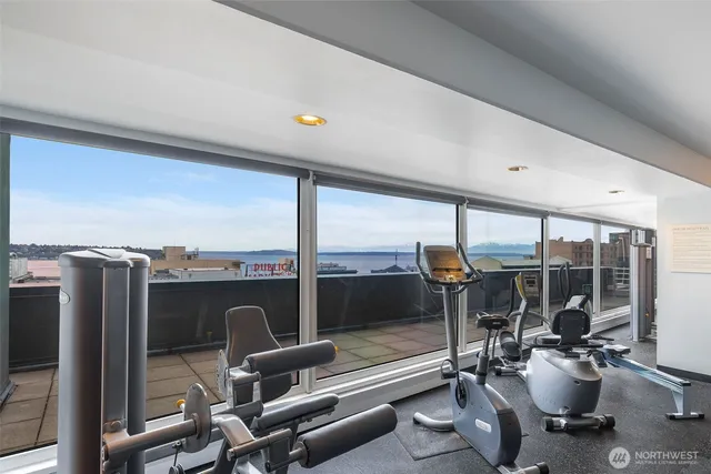 a view of pool with seating area