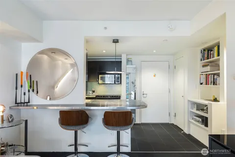 a bedroom with a bed couch and a window