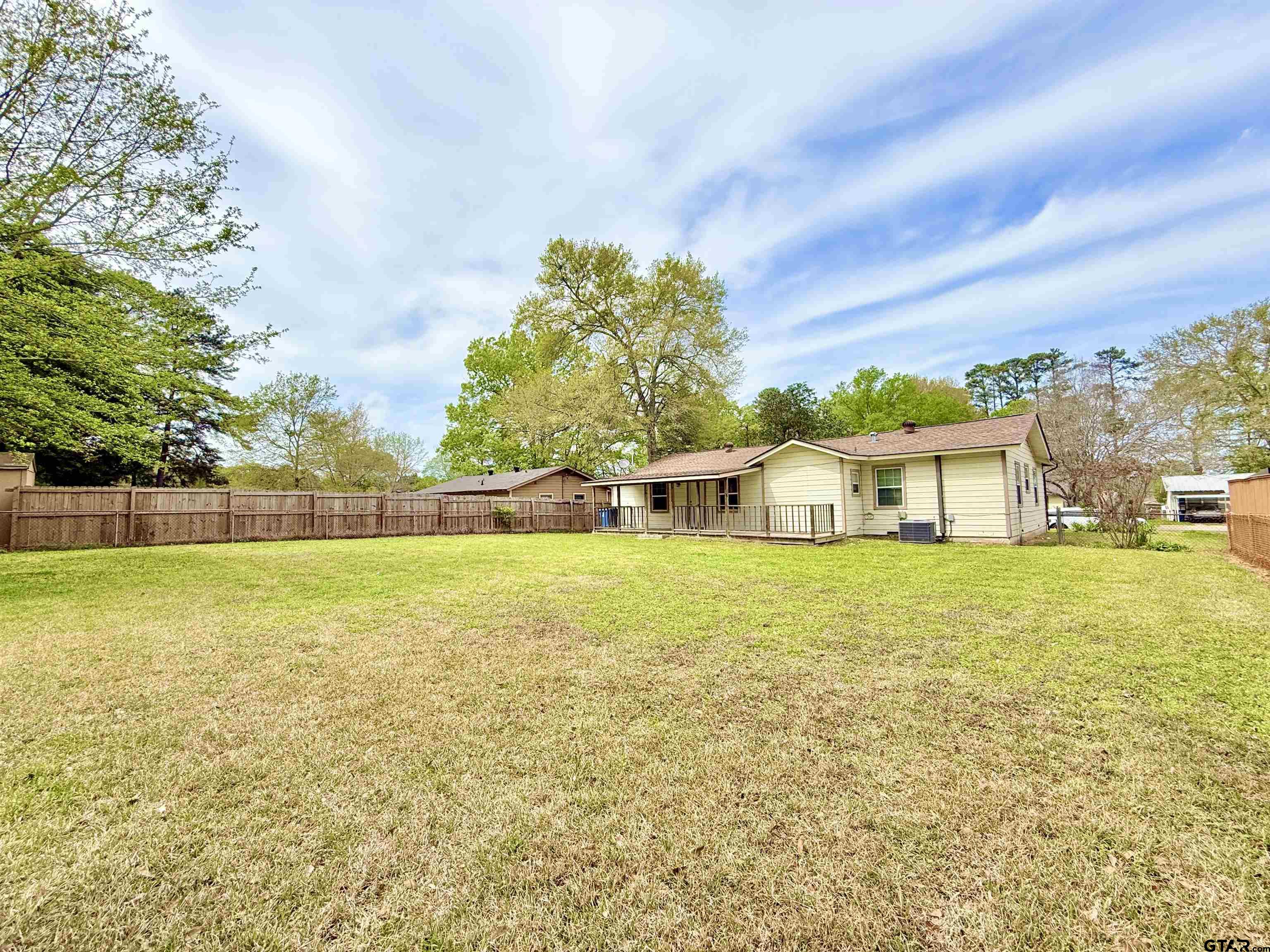 404 Beckley Street Kilgore, TX 75662 - Photo 16 of 20 a front view of a house with a big yard